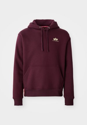 Burgundy hoodie with front pocket, drawstring hood, and gold logo on chest. Ribbed cuffs and hem texture enhance fit and style.