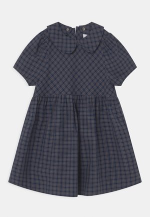 Robe à carreaux bleu marine avec manches courtes, col rond et jupe froncée. Dotée d'une fermeture à boutons dans le dos et d'un tissu doux au toucher.