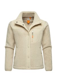 Giacca in pile di un beige chiaro con superficie texturizzata, bottoni a scatto, una tasca sul petto con zip e colletto alto. Presenta dettagli in tessuto a contrasto.