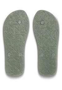 Insoles verde chiaro con una superficie testurizzata caratterizzata da motivi geometrici e due pulsanti circolari sul lato inferiore per stabilità e adattamento.