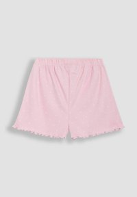 Lyserøde bomuldsshorts med hvide prikker, elastisk talje, bølgede kanter og en afslappet pasform. Set bagfra på en grå baggrund.