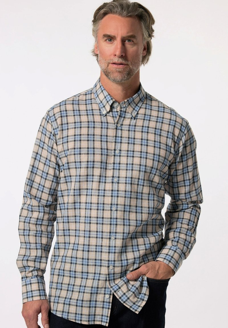 Camicia a quadri in beige, blu e nero. Presenta maniche lunghe, colletto e orlo curvo. Realizzata in tessuto tessuto.