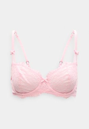 Pink blonder-bh med bølgede kanter, bøjleunderstøttelse og justerbare skulderstropper med dekorative sløjfer. Tekstureret blomsterprint over det hele.