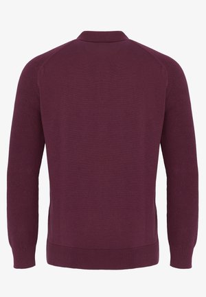 Pull en tricot à manches longues de couleur violet foncé, vu de dos, avec un ourlet côtelé, des poignets et un petit col.