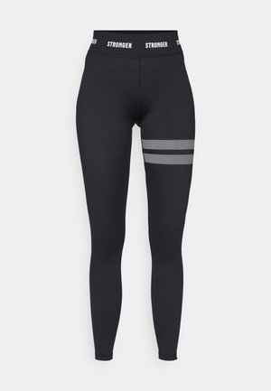 Black leggings with a high waist, featuring a white "STRONGER" logo on the waistband and mesh accents in horizontal stripes on the thigh.