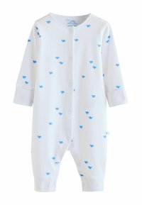 Barboteuse blanche côtelée pour bébé avec imprimés de baleines bleues, manches longues, boutons-pression à l'avant et aux poignets des jambes.