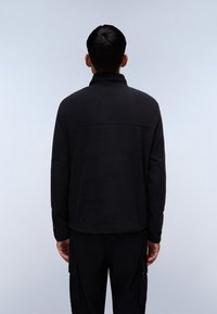 Black fleece pullover with a high collar, featuring a relaxed fit and a smooth texture. Includes subtle seam detailing and long sleeves.