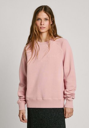 Helles rosa Sweatshirt mit Rundhals und Raglanärmeln. Verfügt über eine erhabene Schriftart auf der Vorderseite sowie elastische Bündchen und Saum.