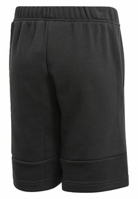 Shorts en coton noir avec une taille élastique, des coutures plates et un ourlet au bas. Texture lisse, conçu pour le confort.