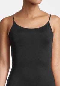 Black camisole top with thin straps, made from smooth, stretchy fabric, featuring a simple design and a fitted silhouette.