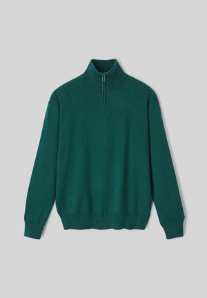 Pull-over vert avec col montant et demi-zip. Fabriqué en matériau tricoté doux, avec des poignets et un ourlet côtelés.