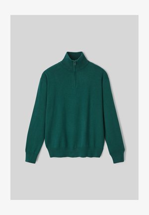 Pull-over vert avec col montant et demi-zip. Fabriqué en matériau tricoté doux, avec des poignets et un ourlet côtelés.