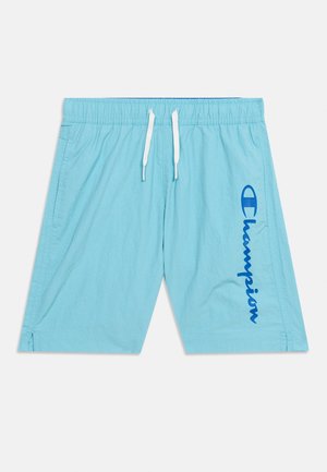 Light blue men's elastic waist shorts with white drawstring and vertical blue "Champion" logo on the right leg.