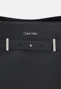 Calvin Klein CODE HOBO - Handtasche - black