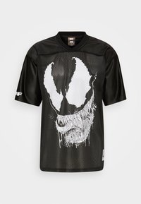 Black mesh jersey featuring a large white graphic of a skull-like face with fangs and dripping details. Short sleeves and crew neckline.