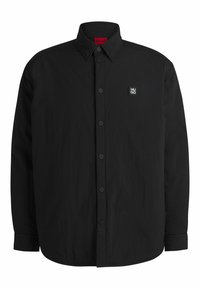Black long-sleeve shirt with a button-down collar, subtle texture, and a small rectangular logo on the left chest. Black buttons and cuffs.