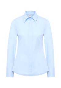 Light blue long-sleeve shirt with a pointed collar, button closure, and a curved hem. Smooth texture with no visible patterns or accents.