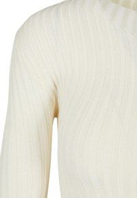 Lichtbeige geribde langemouwen top met een v-hals en textuurstof, die verticale strepen benadrukt voor een aansluitende uitstraling.