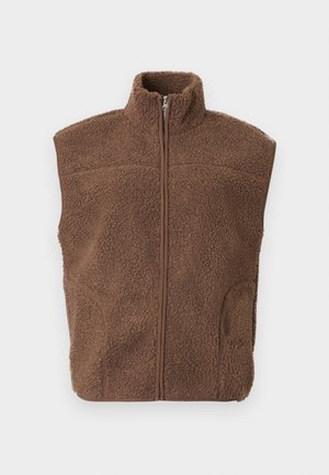Brown fleece vest with a high collar, full zip closure, and side pockets. Textured surface with a relaxed fit.