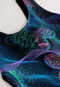 Multicolored, black swimwear featuring a wave-like pattern in blue, green, pink, and purple dots, with a sleek, smooth texture and racerback design.