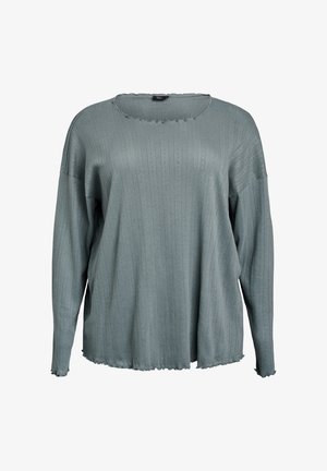 Vaaleansininen pitkähihaisten paita, joka on valmistettu teksturoidusta kankaasta. Siinä on pyöreä pääntie, ribattu kuviointi sekä raakareunat, ja se on väljää istuvuutta.