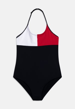 Maillot de bain une pièce avec un design en blocs de couleurs comprenant des sections rouge, blanc et noir. Fabriqué en tissu lisse et extensible, avec un col halter.