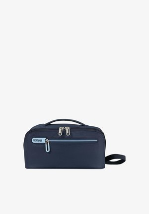 Borsa da toilette compatta blu navy con tasca frontale con cerniera, doppia cerniera superiore, maniglia laterale e logo American Tourister sulla tasca frontale.