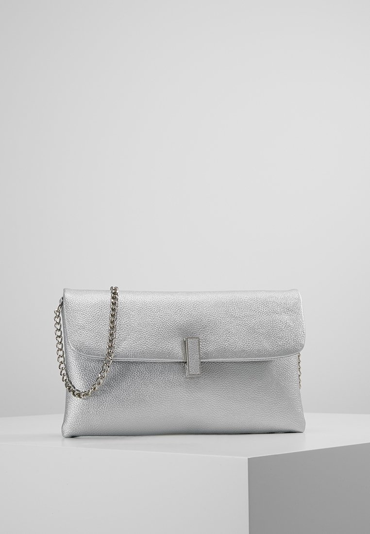 Silver clutch bag made of textured faux leather, featuring a flap closure, a metal chain strap, and a minimalistic rectangular accent.