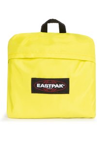 Keltainen nylonkassi, jossa on suorakaiteen muotoinen muotoilu, musta lenkkikahva ja etupuolella Eastpak-logopaneeli. Sileä pinta.
