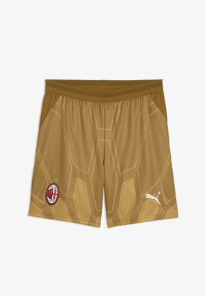 Vaaleanruskeat urheilushortsit, joissa AC Milanin logo vasemmassa lahkeessa ja valkoinen Puma-logo oikeassa lahkeessa, geometrisellä kuviolla.