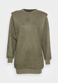 Zielona oliwka bluza z długim rękawem z poduszkami na ramionach, ściągaczami na rękawach i dole, wytłoczone logo "GUESS" na klatce piersiowej.