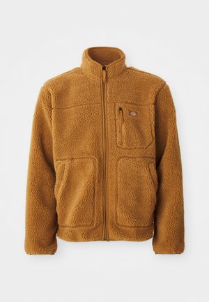 Fleece jacket in a warm brown color featuring a full zip, high collar, two front pockets, and a chest pocket with zip closure.