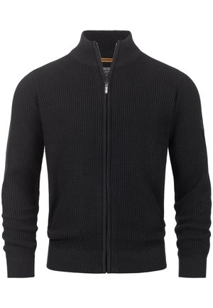 Black knitted zip-up cardigan with a high collar, ribbed cuffs, and hem. Features a textured pattern throughout the body and side logo.