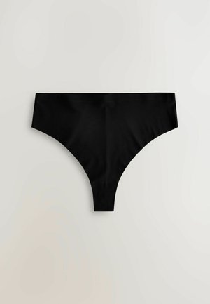 Svart tanga underkläder gjord av slät tyg, med en lågrisk midjeband och sömlösa sidor för minimal synlighet under kläder.