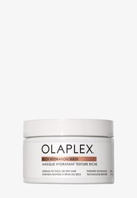 Maschera Idratante Intensa Olaplex in un contenitore cilindrico bianco con un coperchio a vite. Le etichette in nero e oro rosato forniscono informazioni sul prodotto.