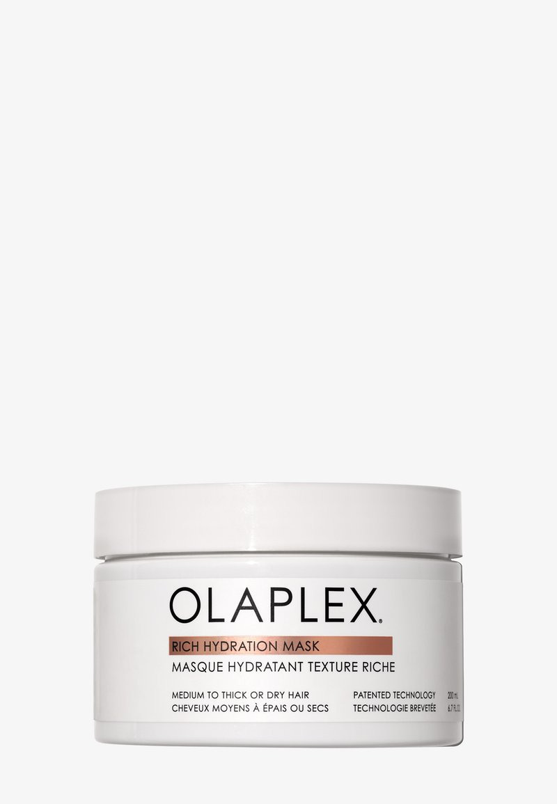 Maschera Idratante Intensa Olaplex in un contenitore cilindrico bianco con un coperchio a vite. Le etichette in nero e oro rosato forniscono informazioni sul prodotto.