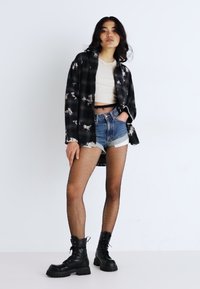 Lee RIDER - Shorts vaqueros - classic indigo