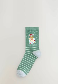 Green striped sock featuring a mouse character in a Santa hat on a gift box. Details include light blue heel and toe sections.