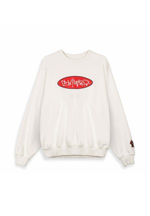 White crewneck sweatshirt with a red oval logo featuring stylized white text on the chest and a small embroidered teddy bear on the right sleeve cuff.
