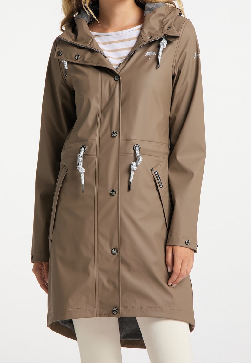 Brown waterproof raincoat with a hood, front buttons, adjustable drawstrings, two side pockets, and a soft inner lining.