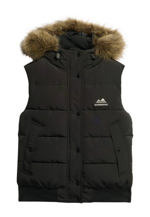 Zwarte puffer vest met bont gevoerde capuchon, drukknoopsluitingen, twee zijzakken en een merkpatch. Het materiaal lijkt duurzaam met een gladde textuur.