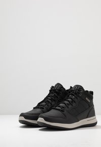Skechers DELSON - Zapatillas altas - black
