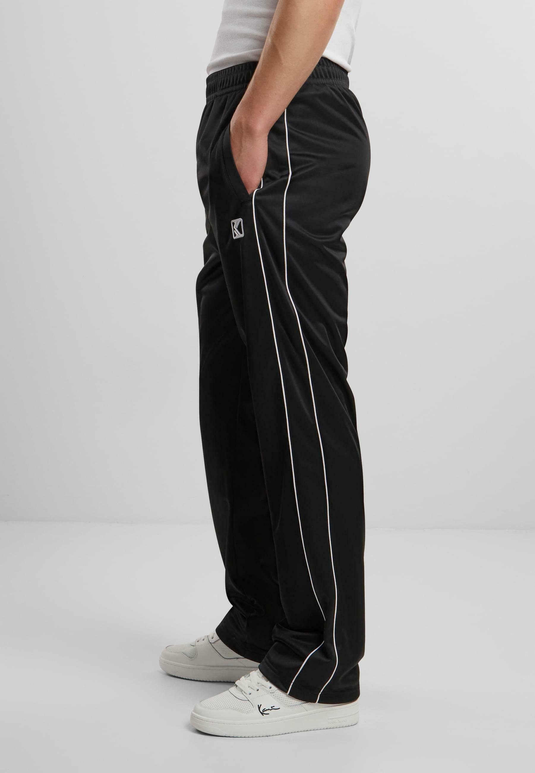 Karl Kani Tracksuit bottoms - black white/multi-coloured - Zalando