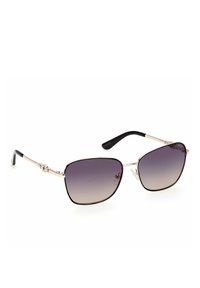 Occhiali da sole con una montatura in metallo argento, lenti quadrate con una sfumatura grigia in gradazione e punte in plastica nera sulle tempie.