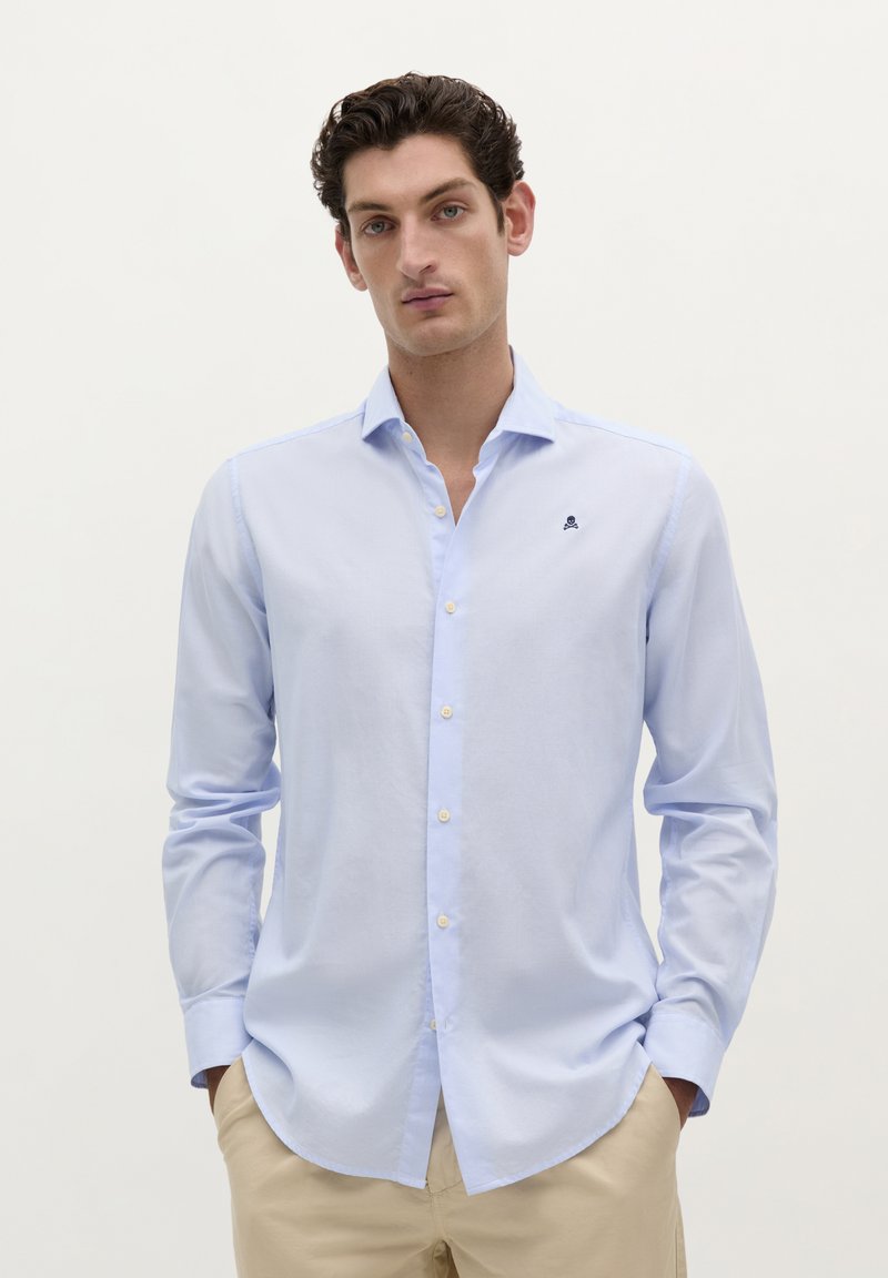 Lichtblauw button-up overhemd van katoen, met lange mouwen, een puntige kraag en een klein geborduurd logo op de borst.