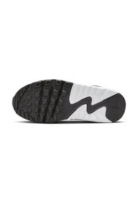 Sole tenisky Nike s černou gumovou podešví, kontrastní bílou mezipodešví, texturovanými vzory na podrážce a charakteristickým logem.