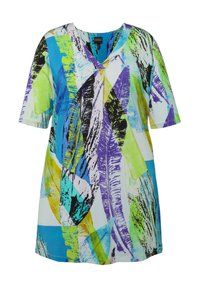 Túnica de mangas cortas con un vibrante estampado abstracto en verde, azul, púrpura y negro sobre un fondo blanco. Tejido suave, ajuste relajado.