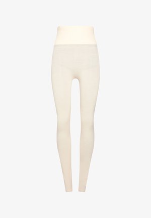 Krämfärgade leggings har en hög midja, slät textur och design i full längd. Tillverkade av ett mjukt, elastiskt tyg för komfort.