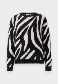 Sort og creme-stribet trøje med en fuzzy tekstur, rund halsudskæring og lange ærmer. Mønsteret ligner zebrastriber på stoffet.