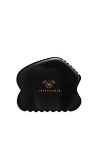 Czarny plastikowy klips do włosów o organicznym, zakrzywionym kształcie. Posiada złote logo "CRYSTALLOVE" oraz teksturowany uchwyt na spodzie.